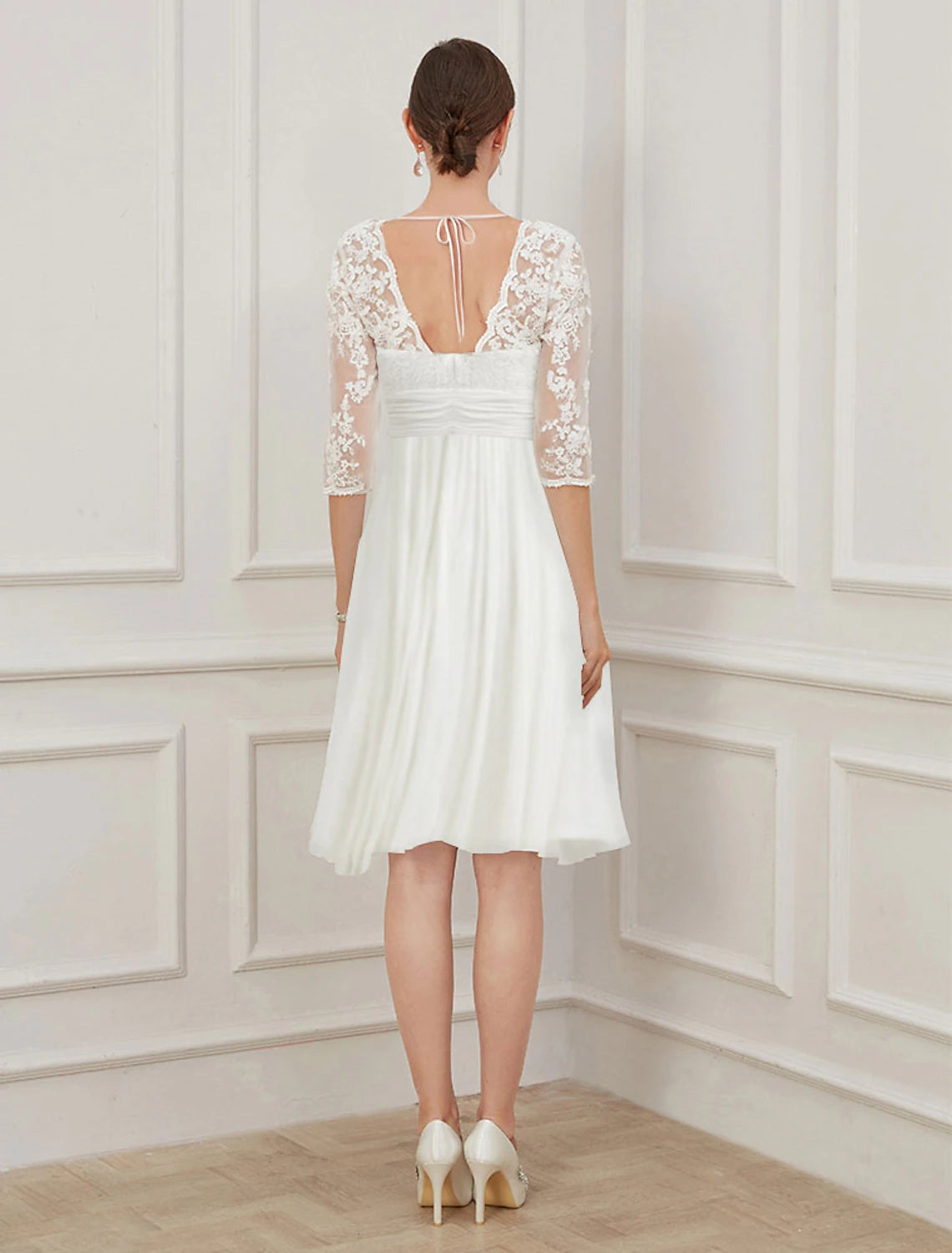 Side view of knee-length A-line chiffon reception wedding dress with half sleeves in Ivory