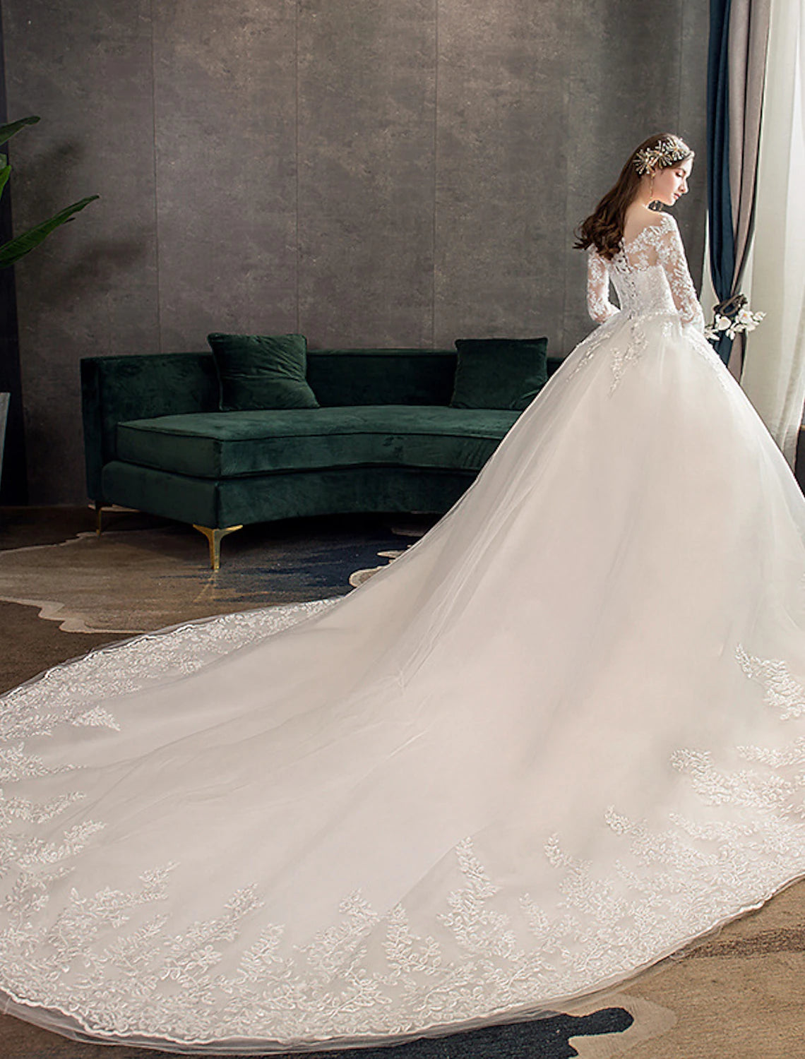 Ball gown bridal dress with lace appliques and pleated skirt