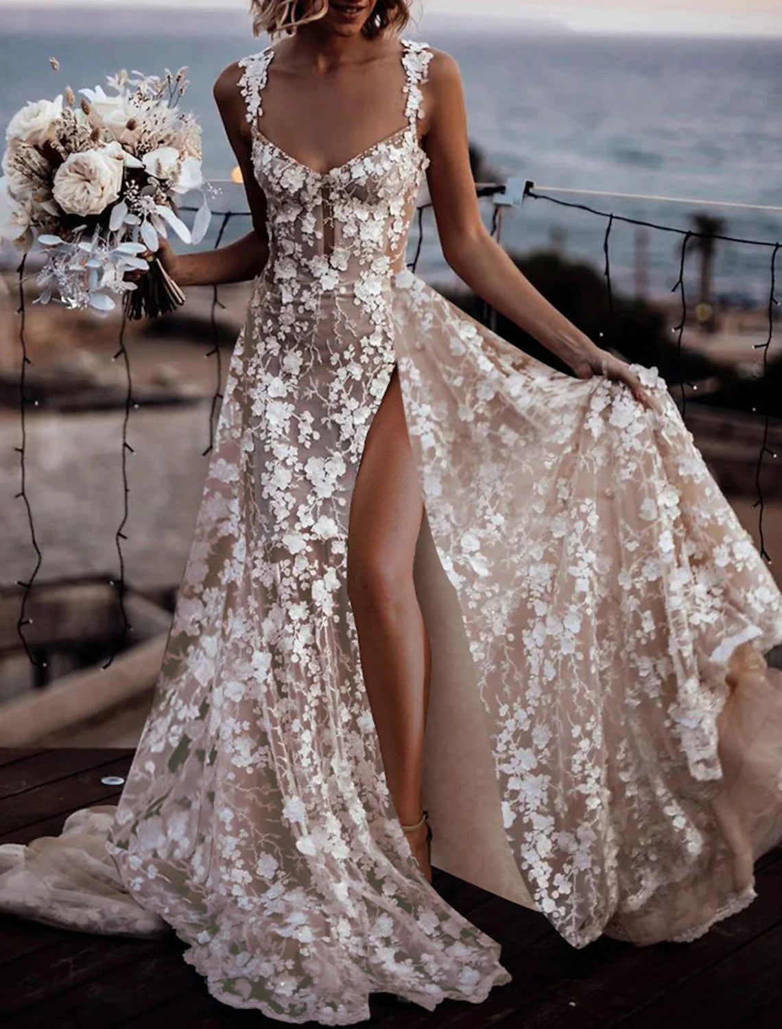A-line lace wedding dress in ivory with sweetheart neckline, regular straps, appliques, and split front