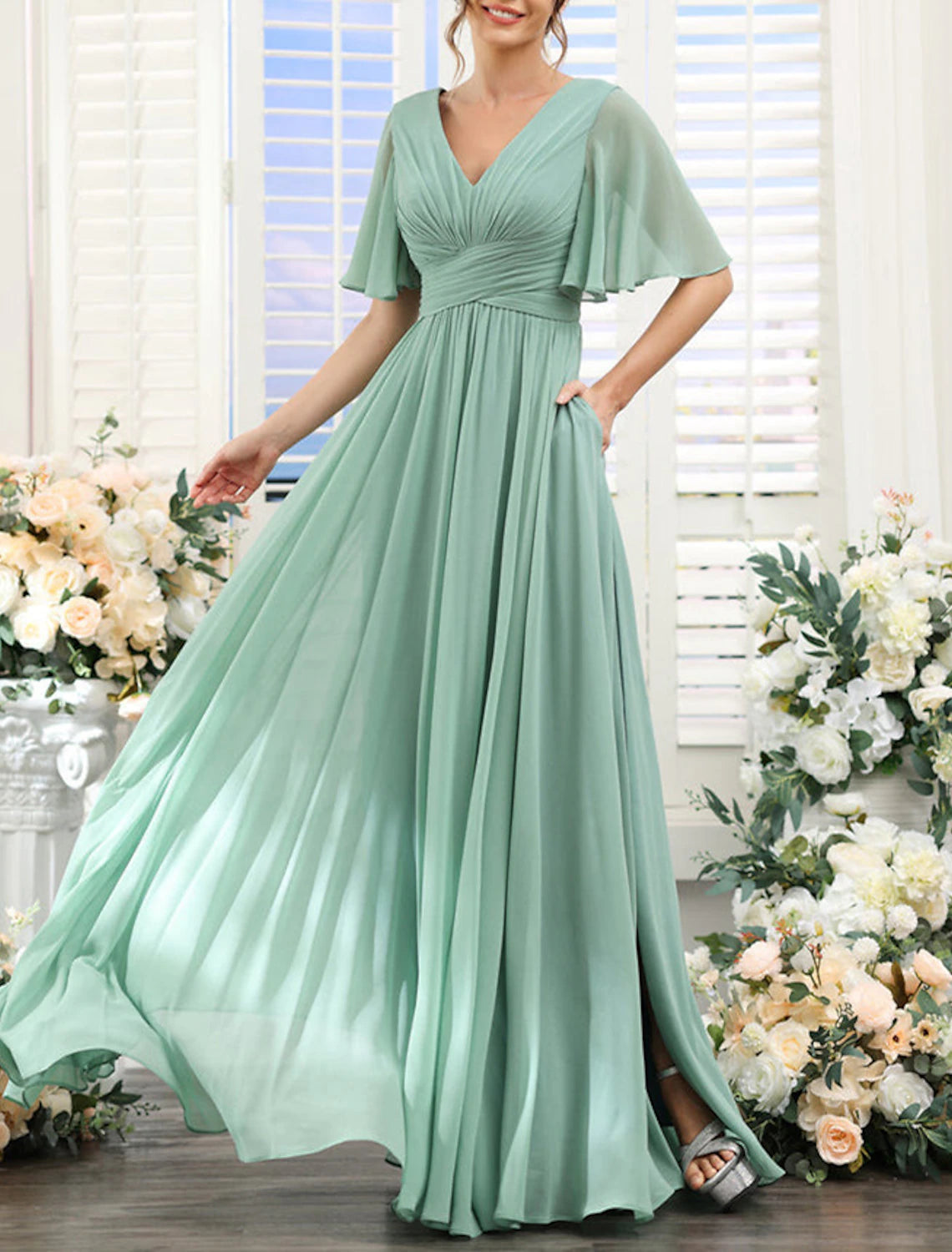 Front view of A-line chiffon bridesmaid dress with V-neck, short sleeves, ruching, and front split