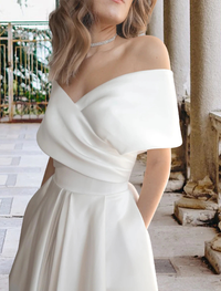 Off-the-shoulder tea-length bridal gown with cap sleeves and lace appliques