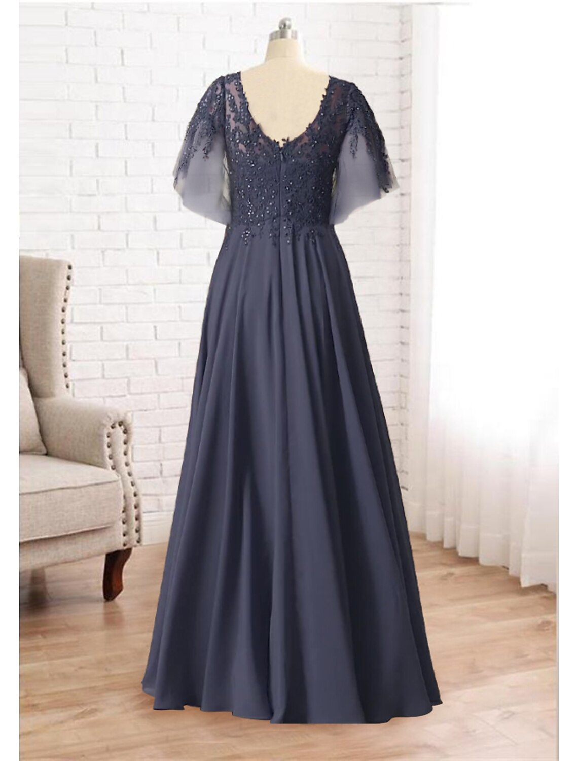 Plus size mother of the bride dress in A-line silhouette with V-neckline and floor-length skirt