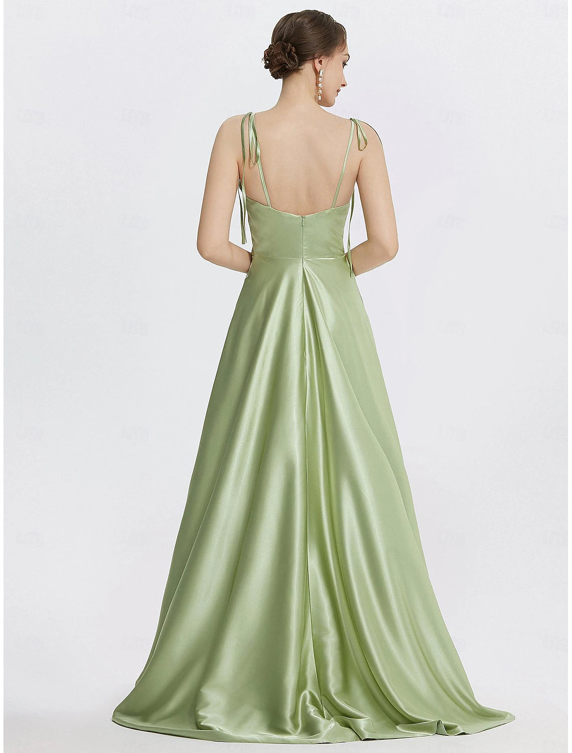 Floor-length A-line satin evening gown in mint green with strappy accents and slit
