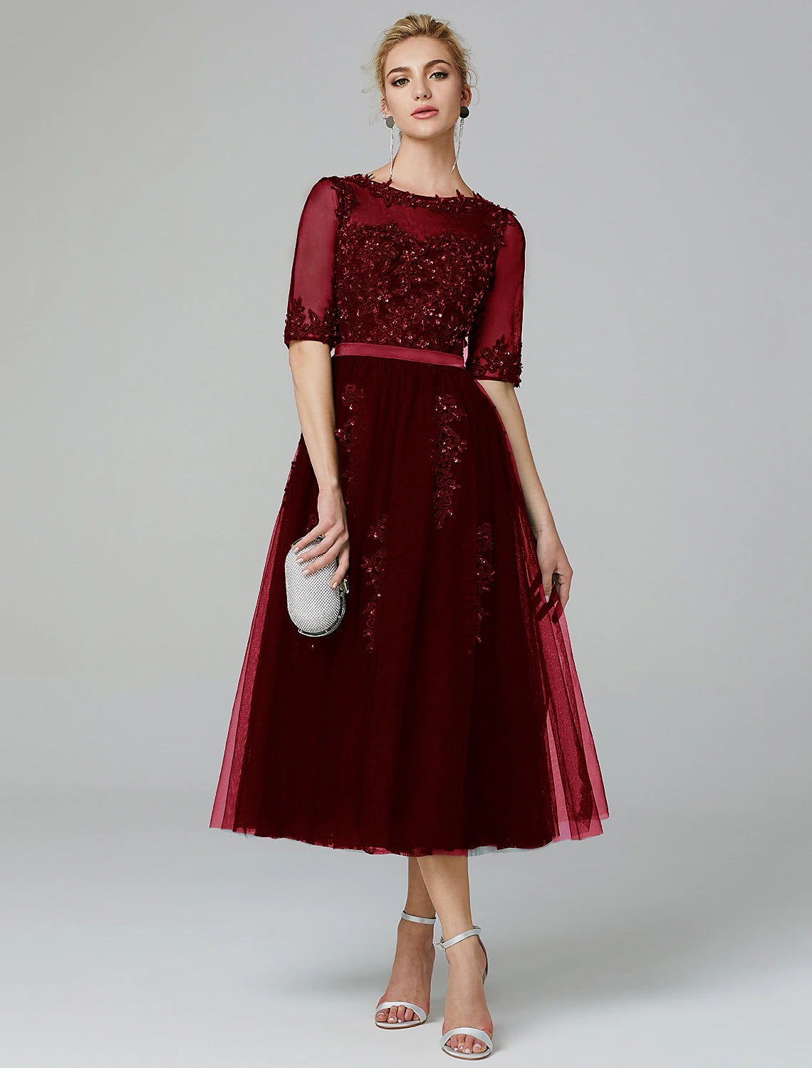 A-line sparkle cocktail dress featuring tea length tulle skirt with sequin appliques
