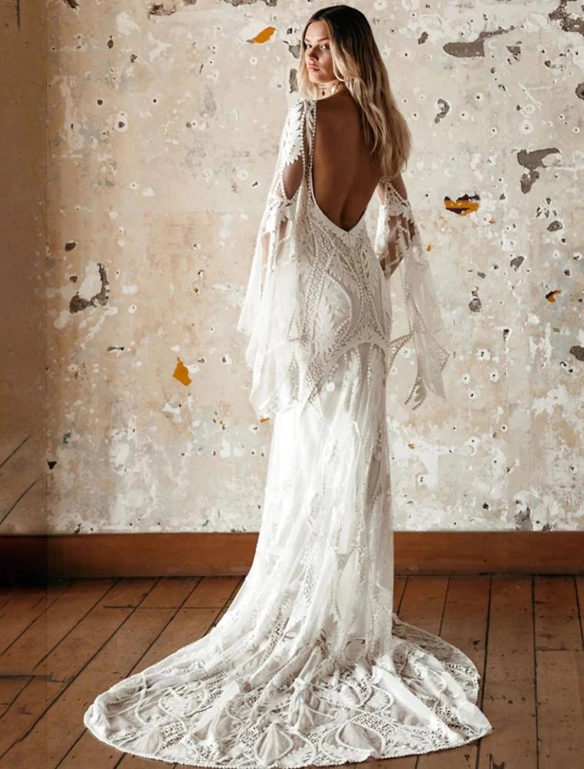 Boho beach bridal gown in patterned lace with V-neck