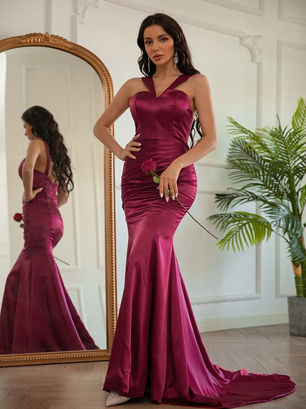 Front view of halter sleeveless ruched silk-like satin sheath prom dress with sweep train