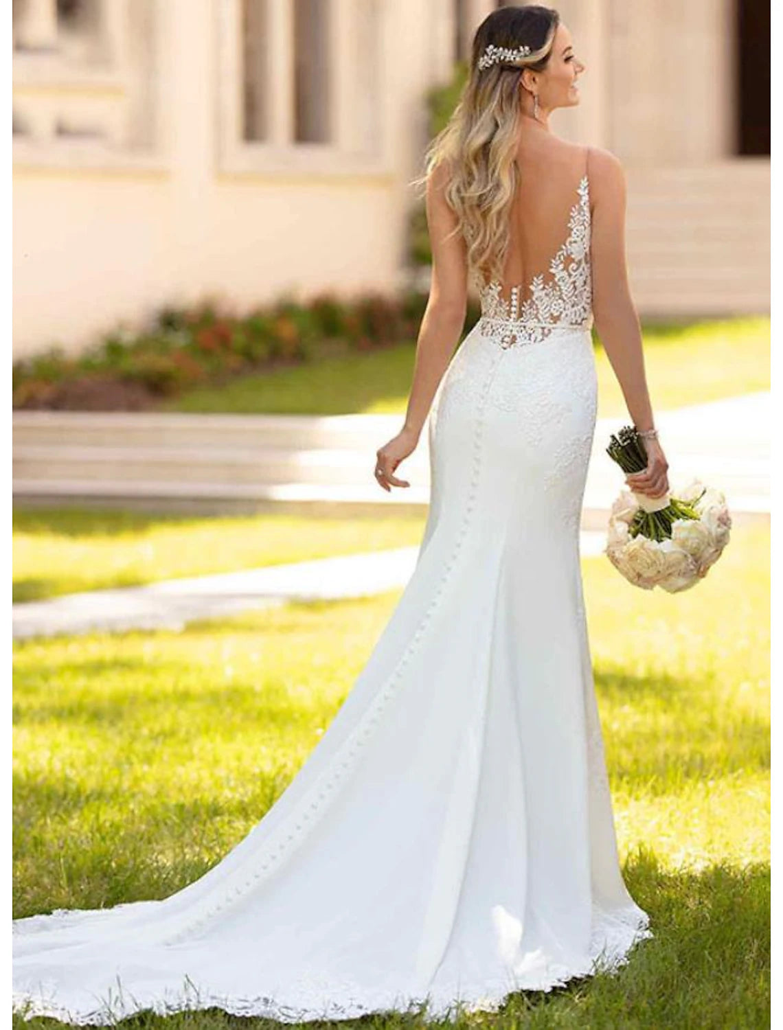 Open back ivory lace mermaid bridal gown with court train and appliques