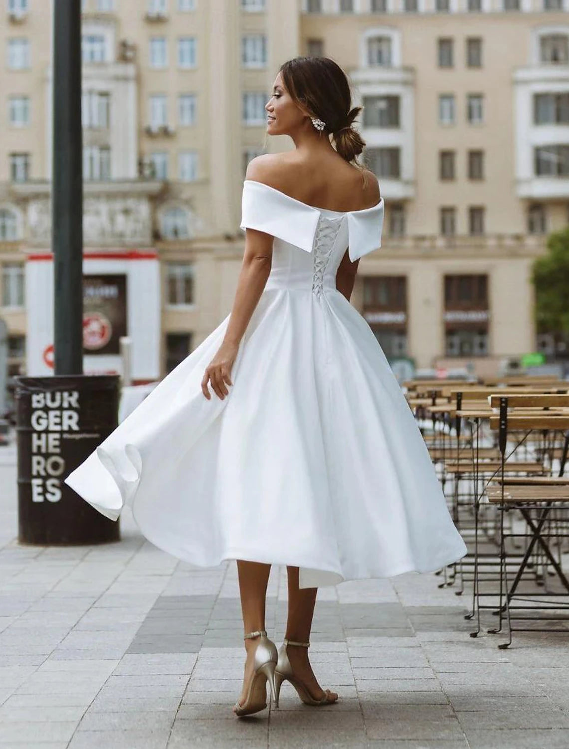 Ivory satin A-line bridal gown with short sleeves and off-the-shoulder neckline