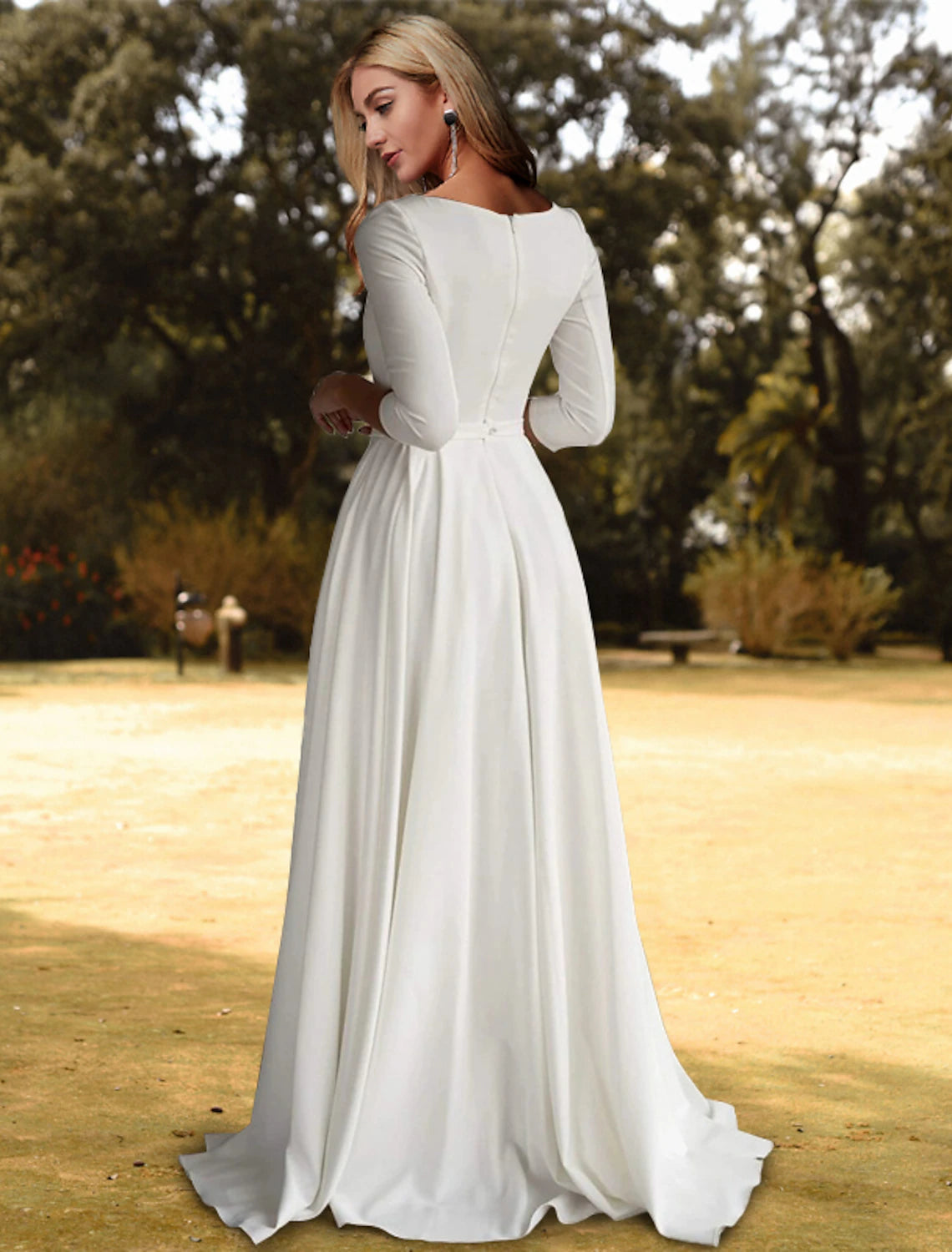White A-line bridal gown with pleated skirt and sweep brush train in stretch fabric