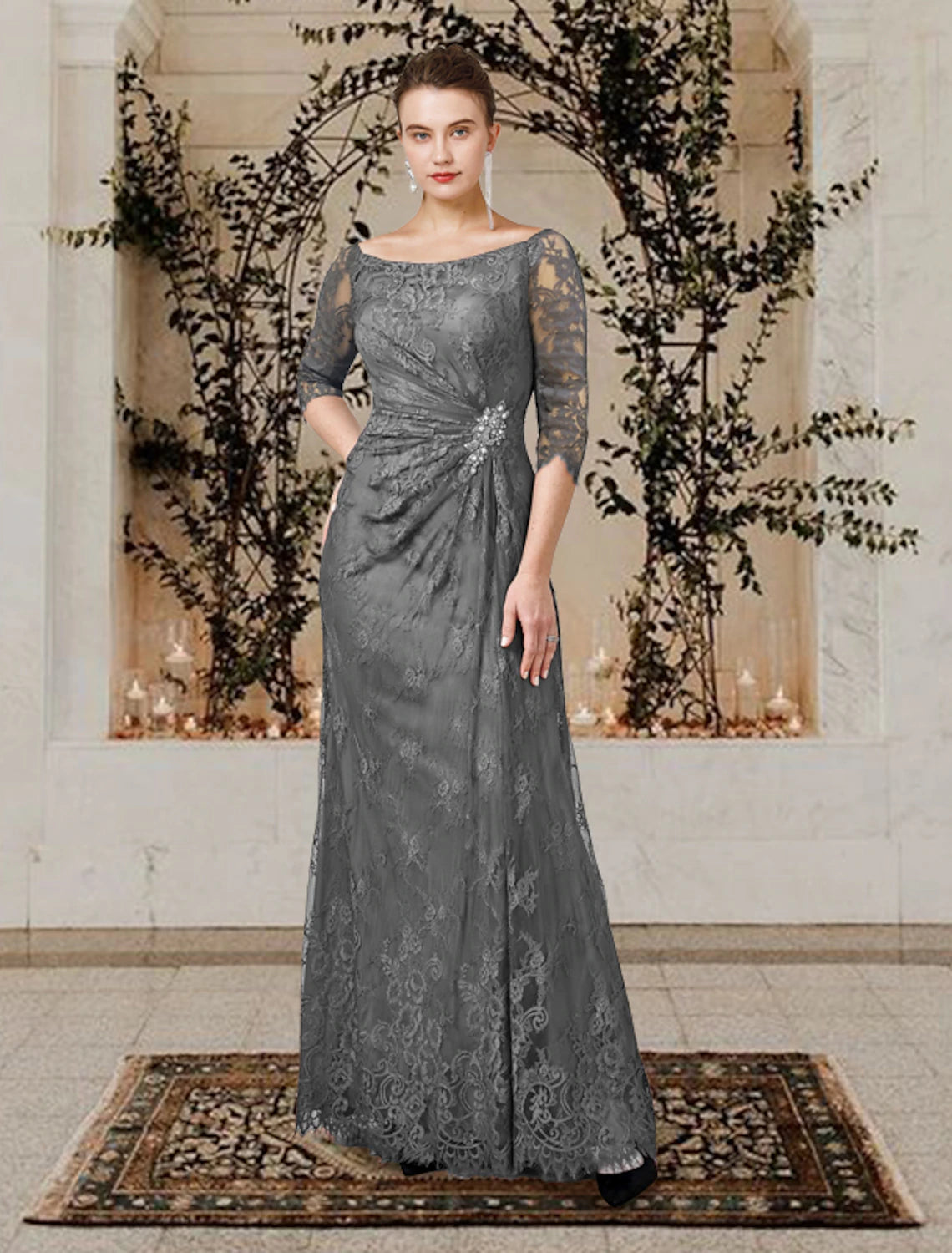 Side-draped detailing with ruffles and a crystal brooch on an A-line mother of the bride dress