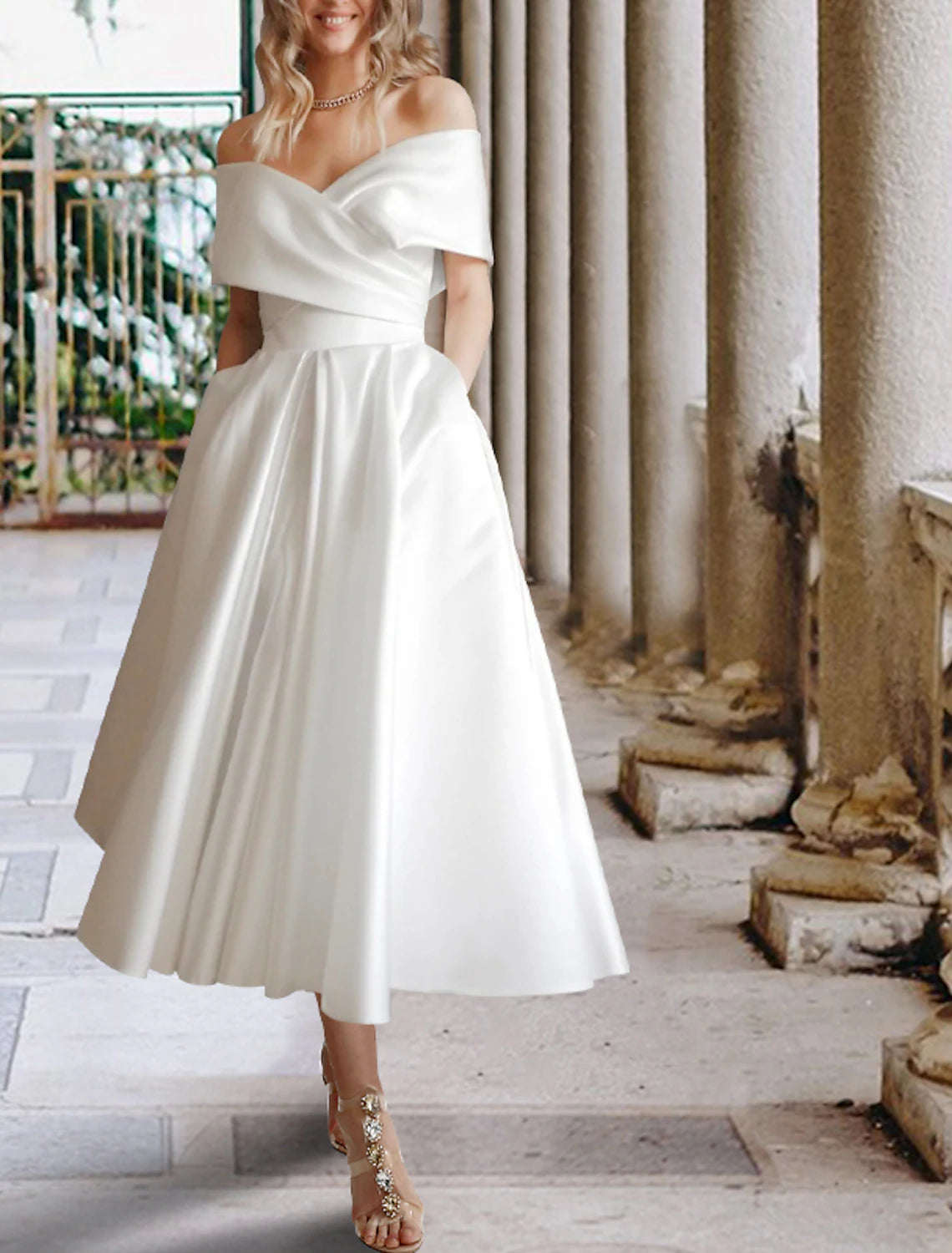 Ivory off-the-shoulder cap sleeve tea-length lace ball gown wedding dress