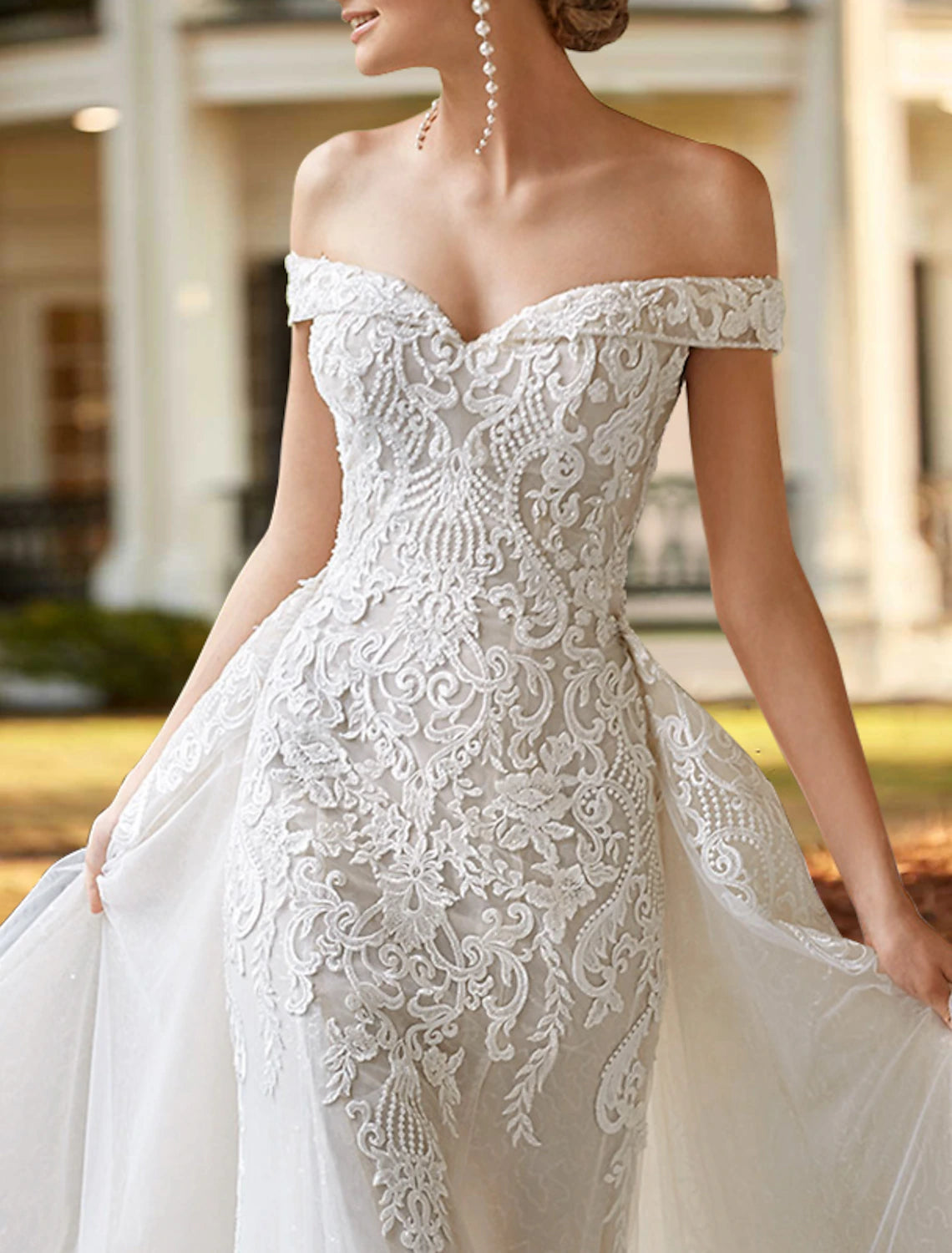 Off-the-shoulder two-piece satin wedding gown in ivory with cap sleeves and beading appliques