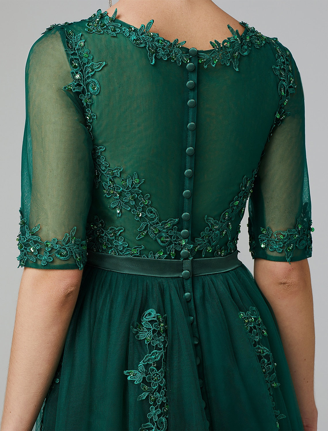 Tea length A-line cocktail dress with illusion neckline and sequin details