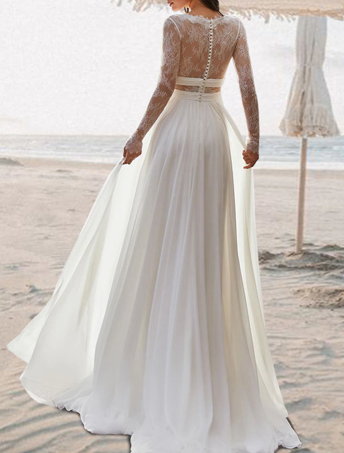 Back view of boho chiffon beach wedding dress showcasing the open back and floor-length pleated skirt