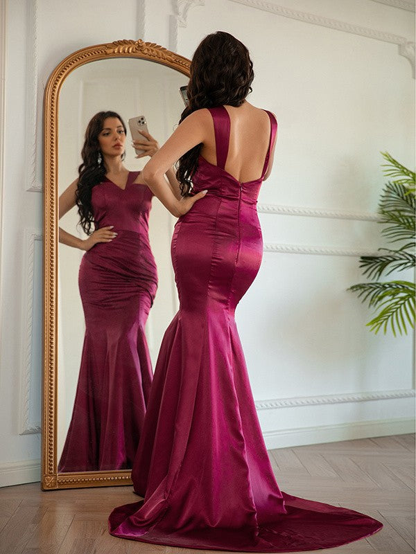 Back view of halter sleeveless ruched silk-like satin sheath prom dress with brush train