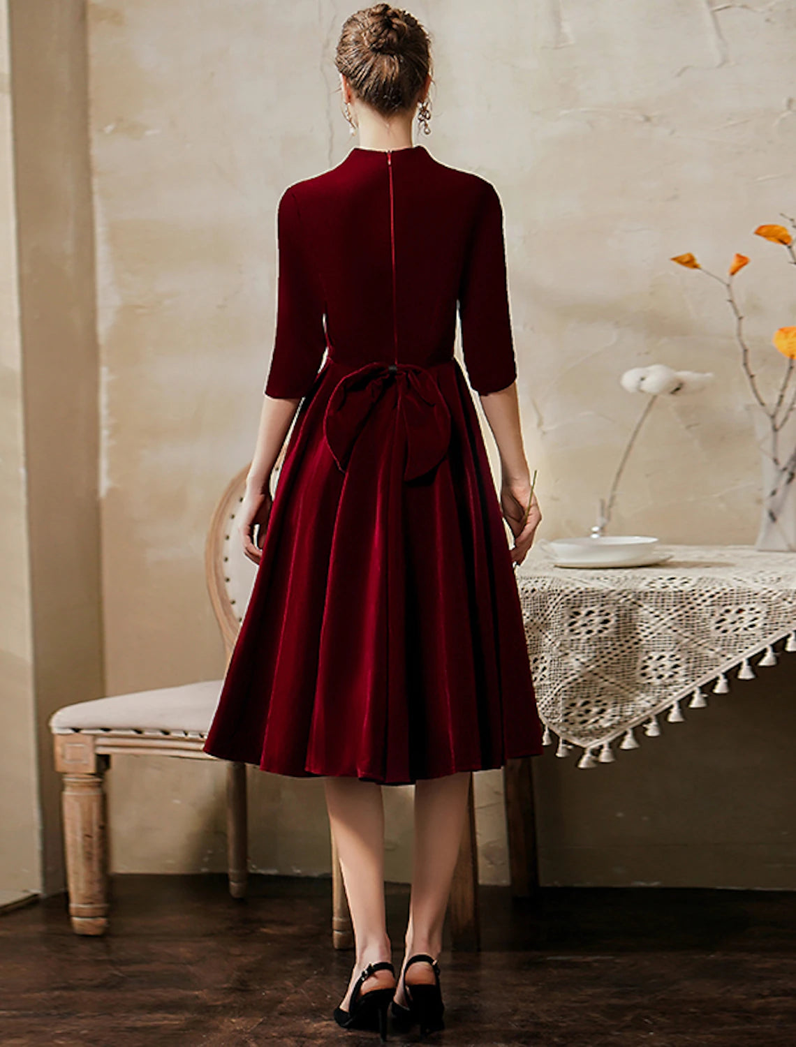 Front view of vintage tea-length velvet A-line party dress with half sleeves