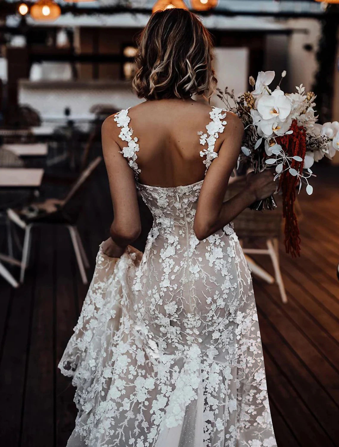 Ivory A-line bridal gown featuring sweetheart neckline, lace appliques, and court train