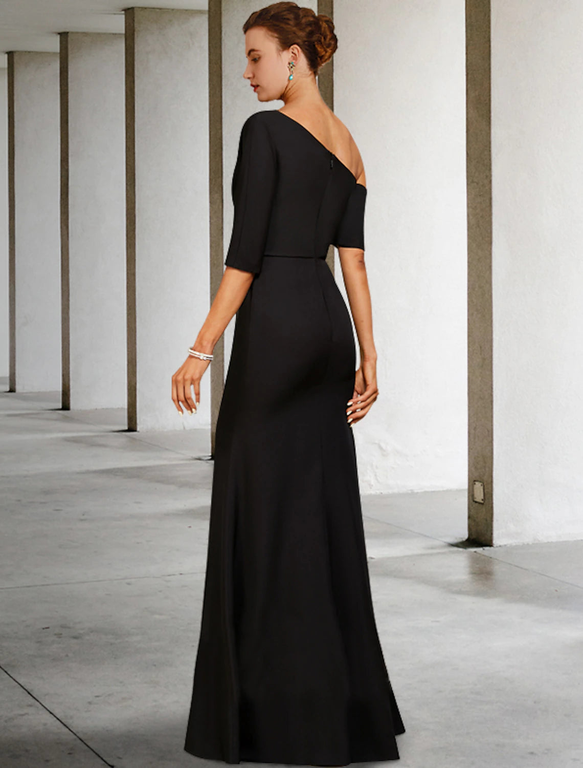 Detailed view of A-line one-shoulder floor-length mother of the bride dress showing 3/4 sleeve and side-draped ruffles
