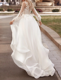 A-line lace applique bridal gown with court train and long sleeves in Ivory