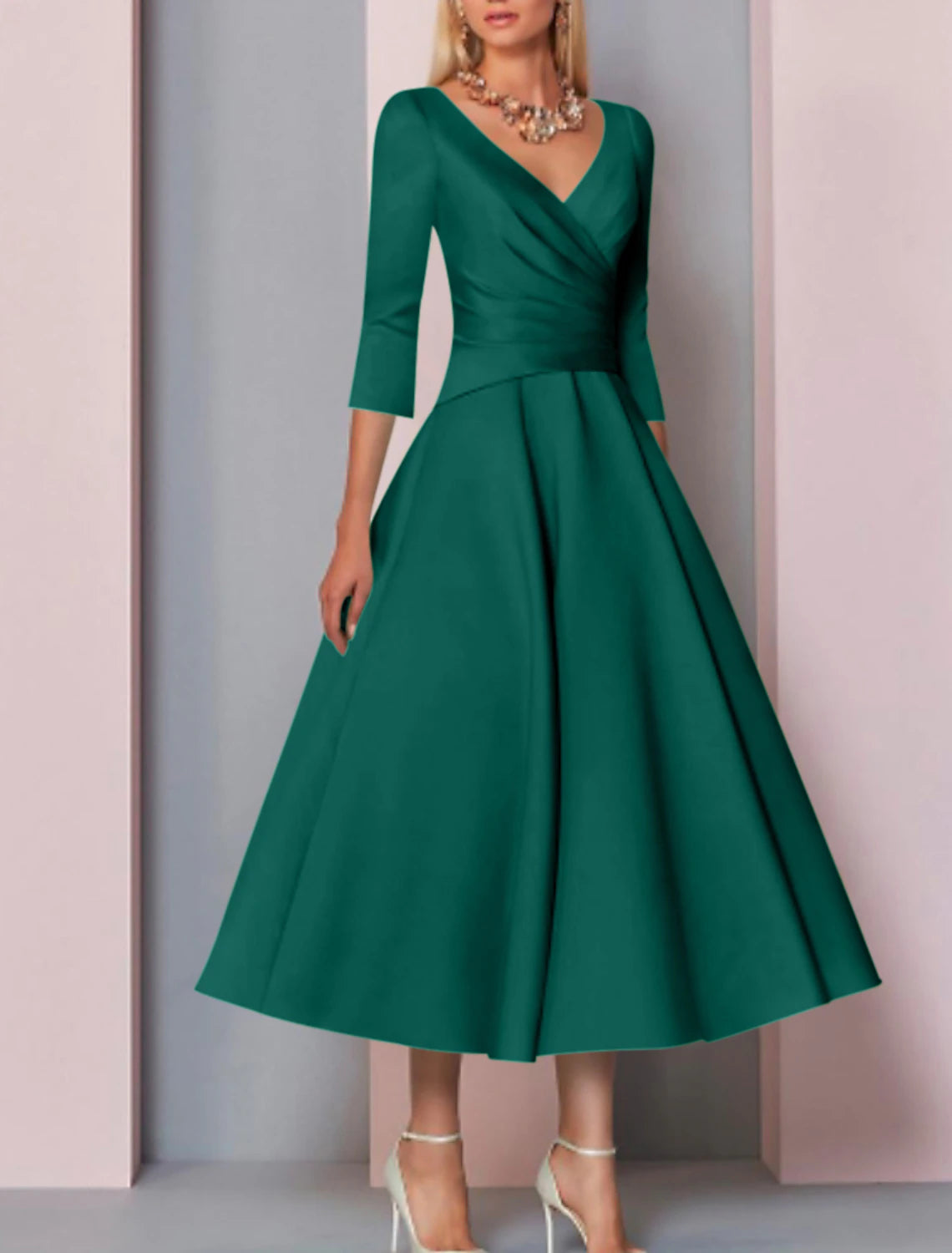Tea-length mother of the bride dress with 3/4 sleeves and pleated satin skirt