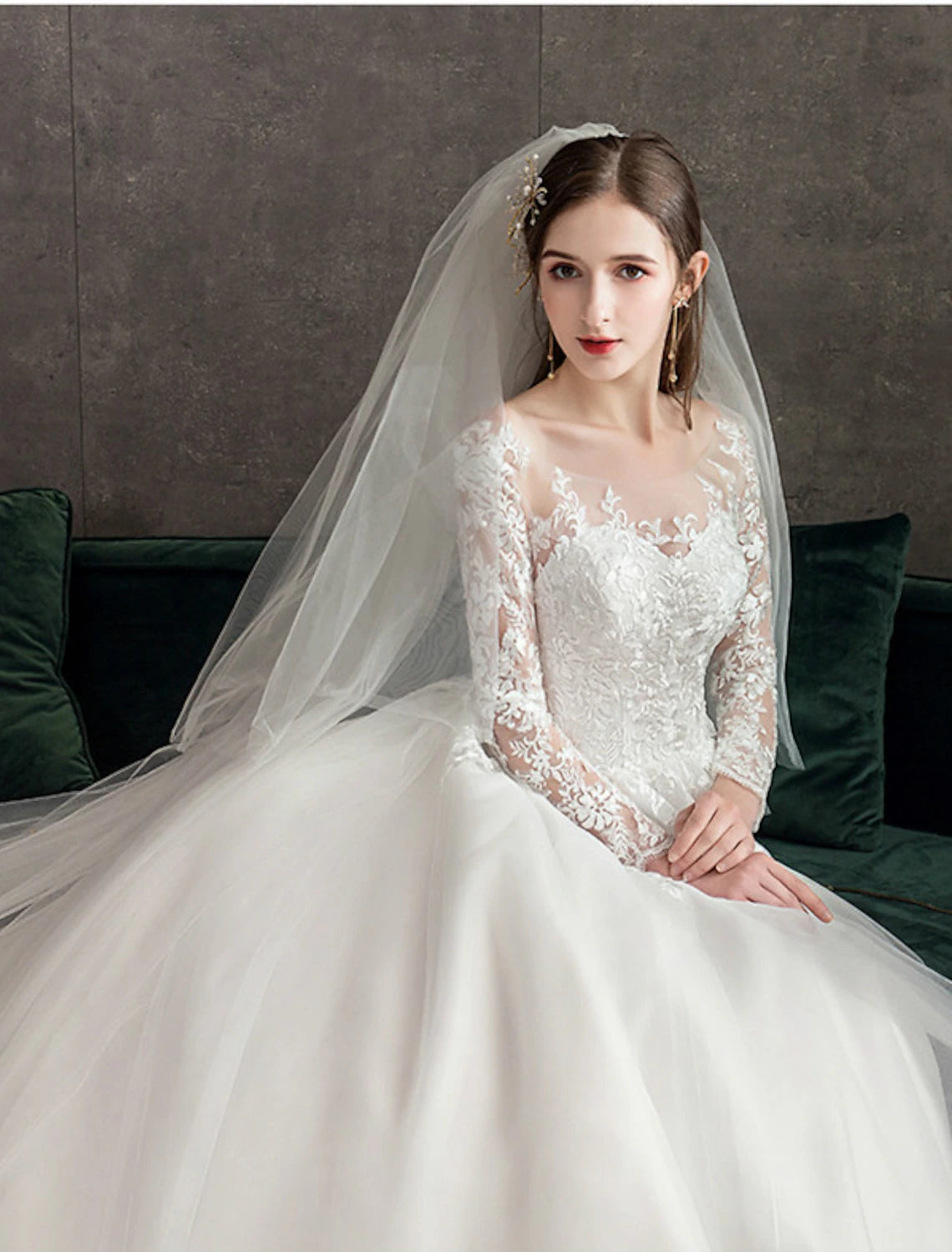 Formal ivory ball gown wedding dress with cathedral train and pleats