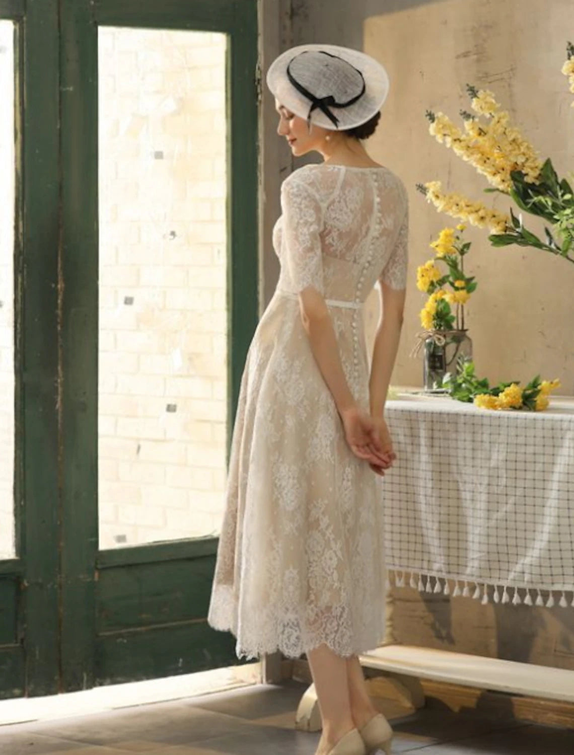 A-line lace tea length wedding dress with sash and appliques in champagne