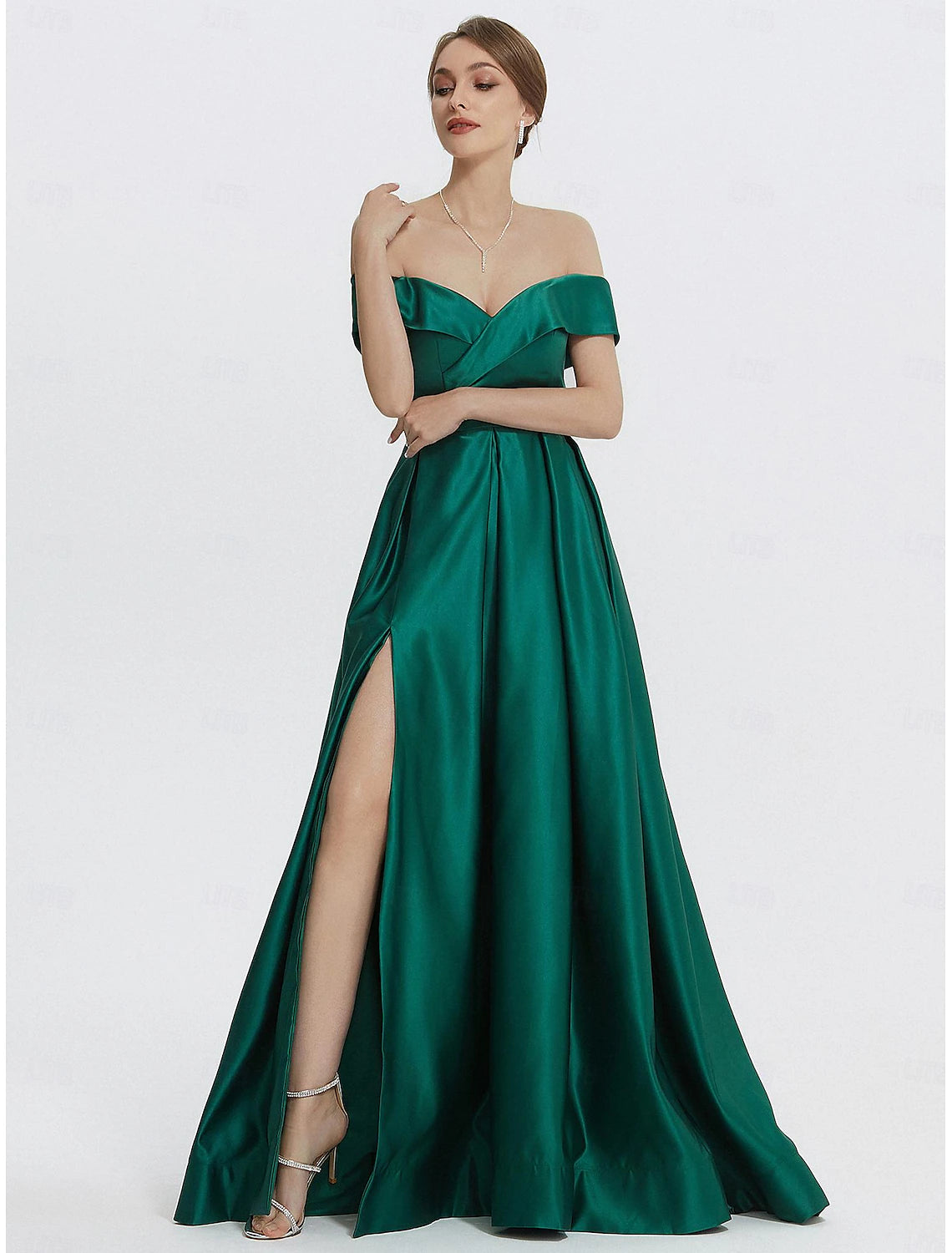 Floor-length satin A-line evening gown with sweetheart neck and leg slit in dark green