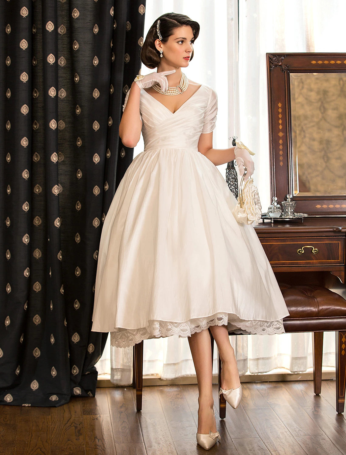 Ivory vintage 1940s tea length A-line satin wedding dress with V-neck and lace criss cross