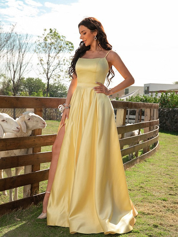 A-line satin sleeveless prom dress with spaghetti straps, ruffles, and a sweep train