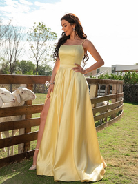 A-line satin sleeveless prom dress with spaghetti straps, ruffles, and a sweep train