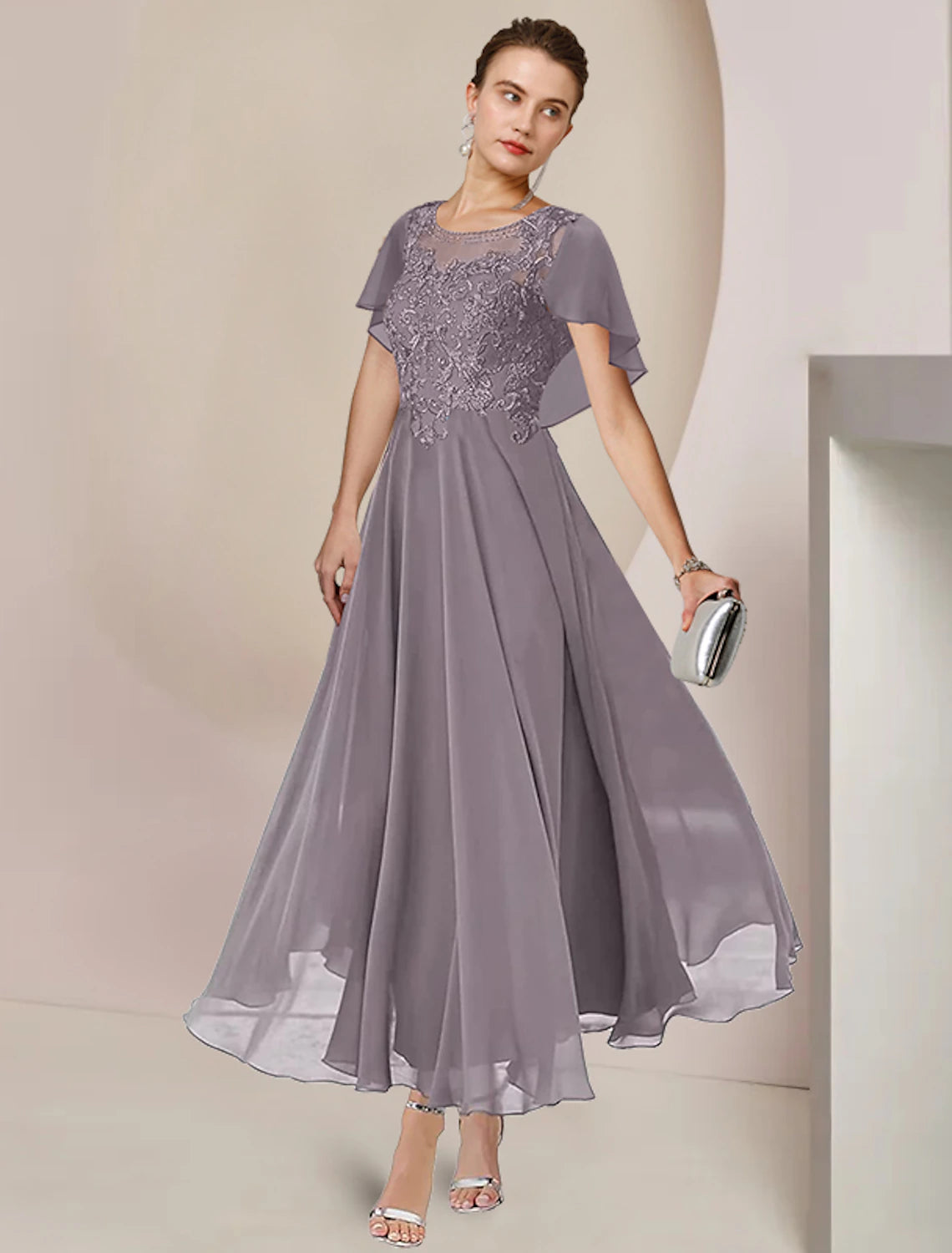 Sleeveless tea-length A-line chiffon and lace mother of the bride dress with scoop neckline and beading appliques