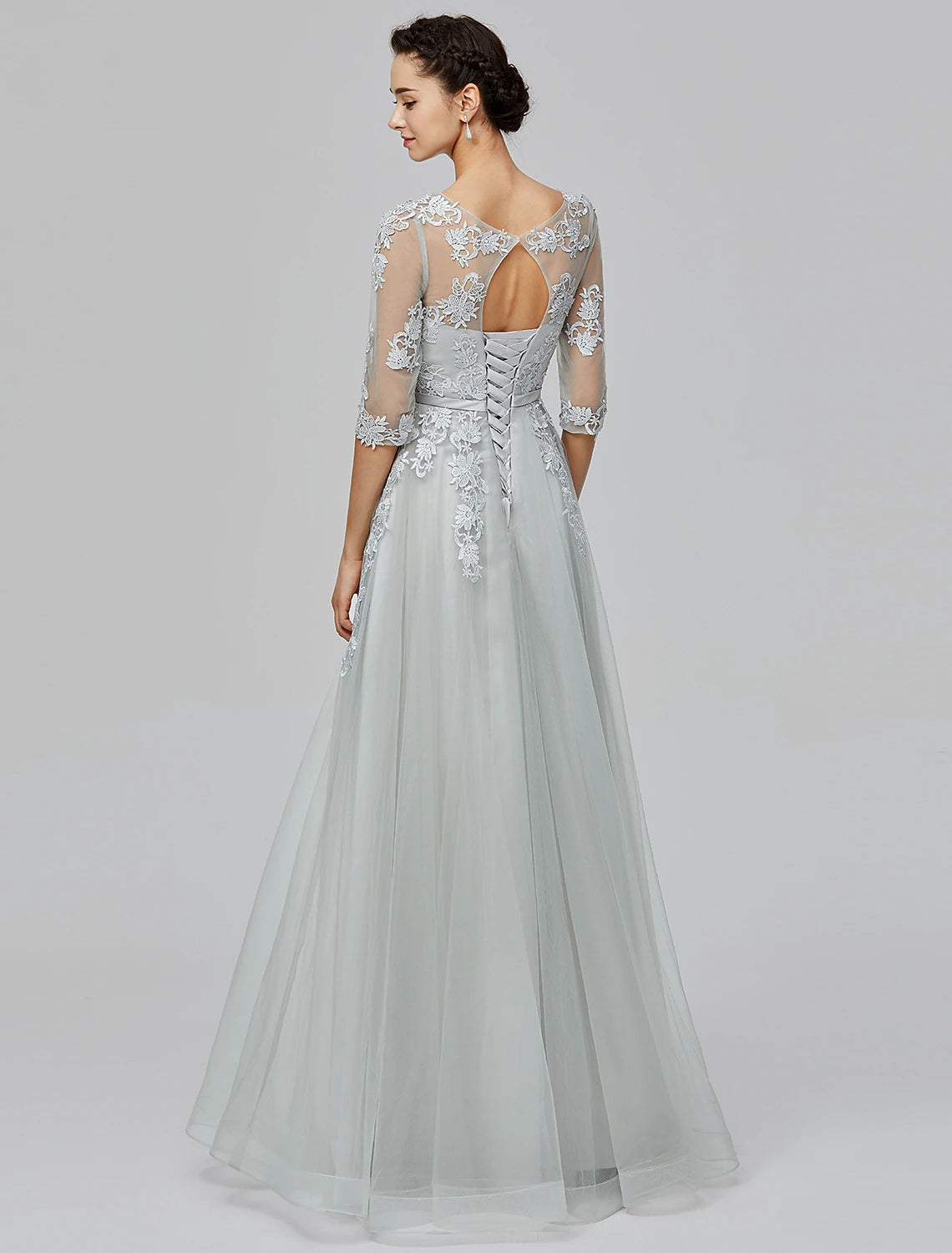 Floor-length silver A-line empire tulle dress featuring bow appliques and half sleeves