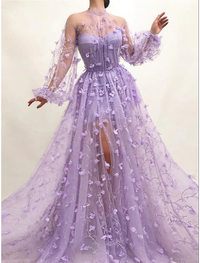 Side view of floor-length A-line prom dress with long sleeves and floral appliques
