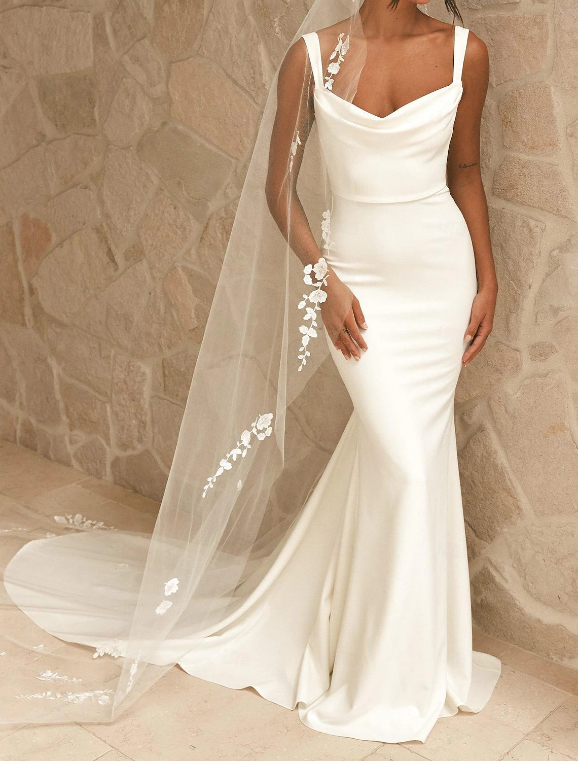 White sheath satin wedding dress with spaghetti straps and beading