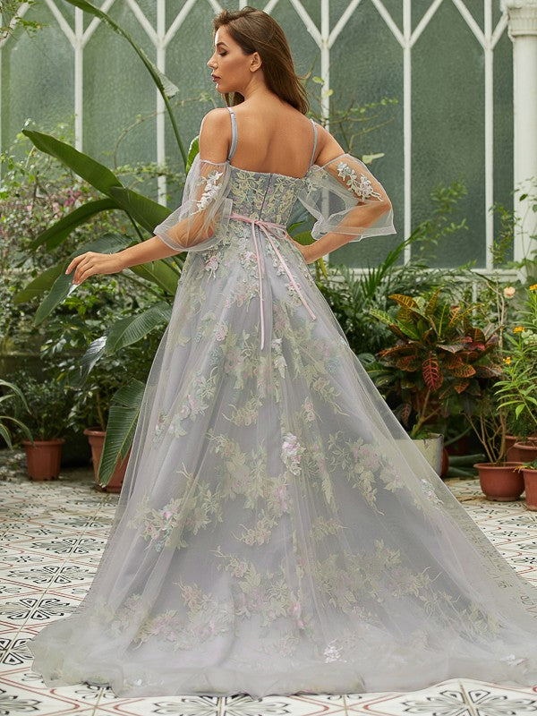 A-line tulle applique prom dress featuring sweep brush train