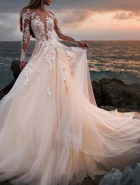 White A-line beach wedding dress with illusion neckline and long lace sleeves