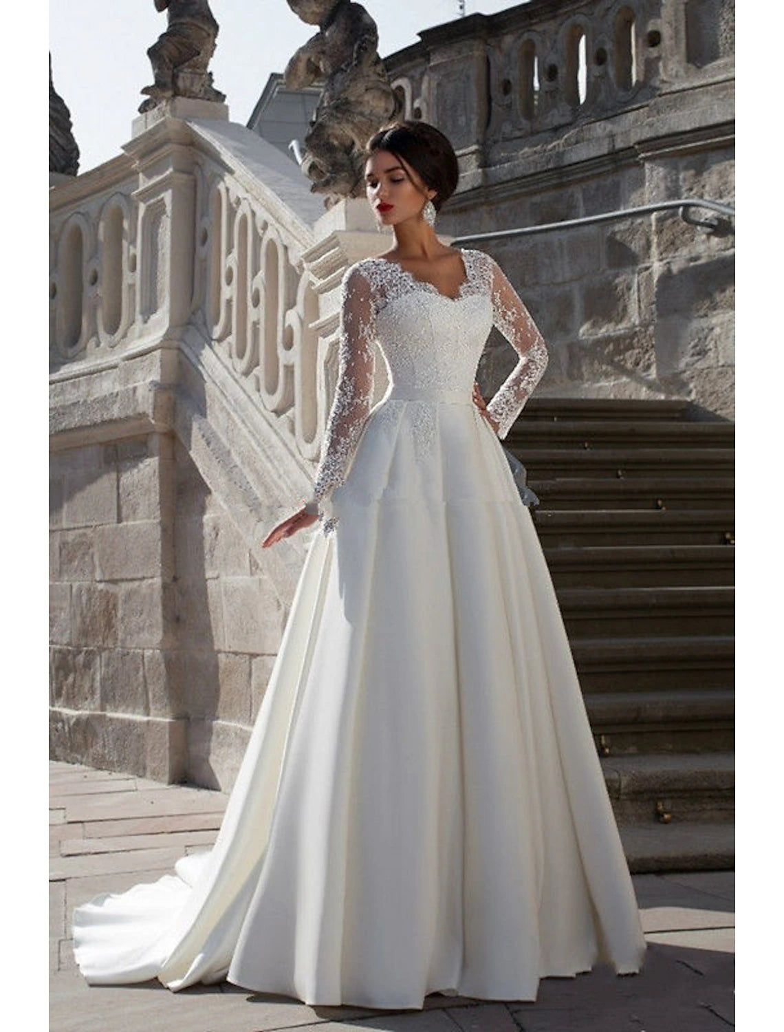 White A-line satin wedding dress with V-neck, long sleeves, appliques, and court train