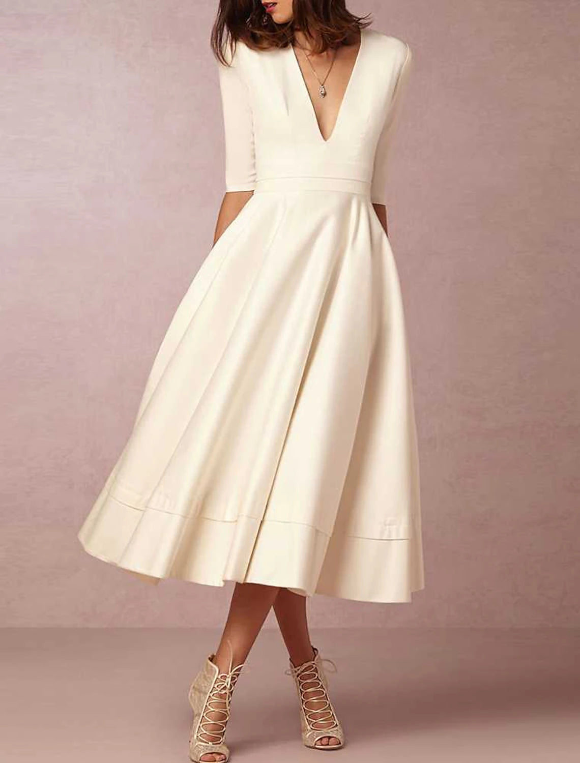 Simple sleeveless V-neck satin beach wedding dress with ruched pleats and court train