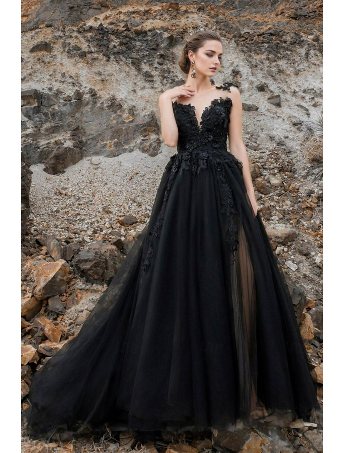 Front view of beach boho black A-line wedding dress with V neck, lace appliques, and front split