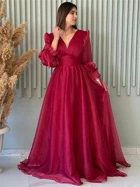 A-line organza prom dress featuring ruched V-neck bodice, long sleeves, and sweep train