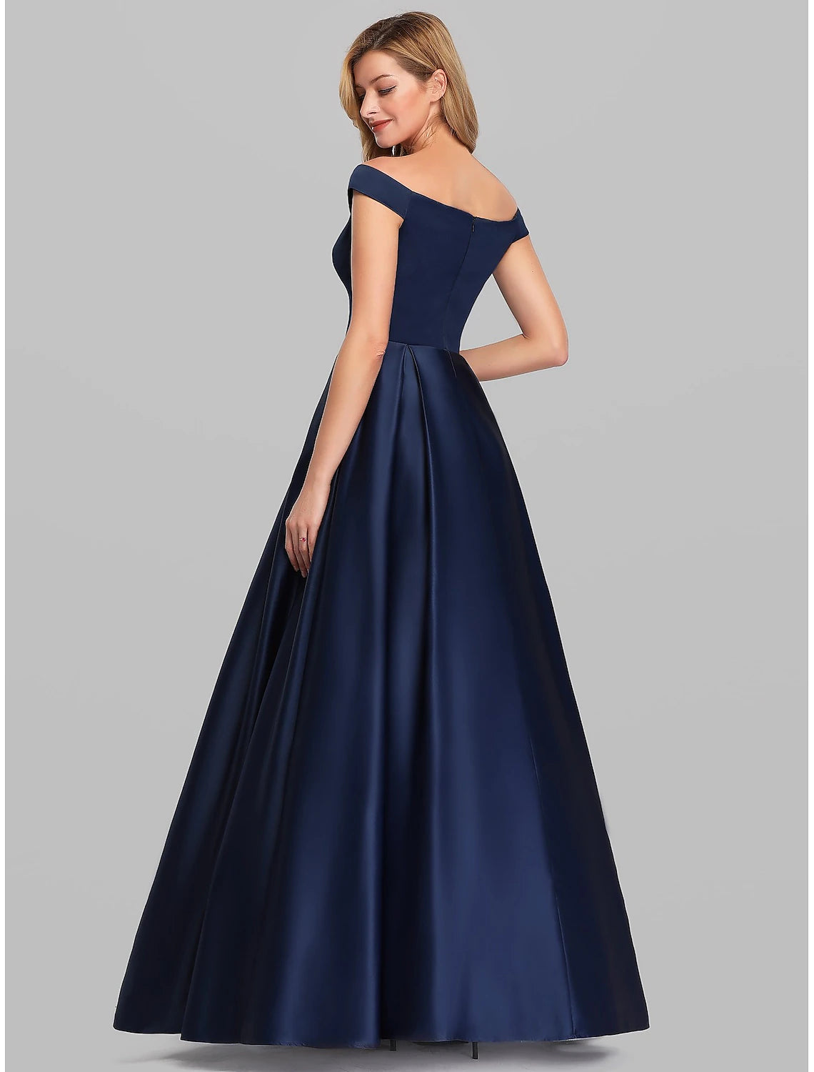 Side view of sleeveless plunging neck satin A-line wedding guest dress with ruched details