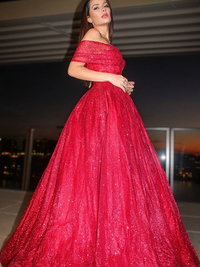 Red ball gown prom dress featuring an off-the-shoulder neckline and ruffles