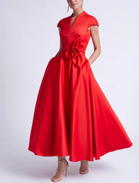 Sleeveless tea-length satin dress with V-neckline, bow detail, and pockets
