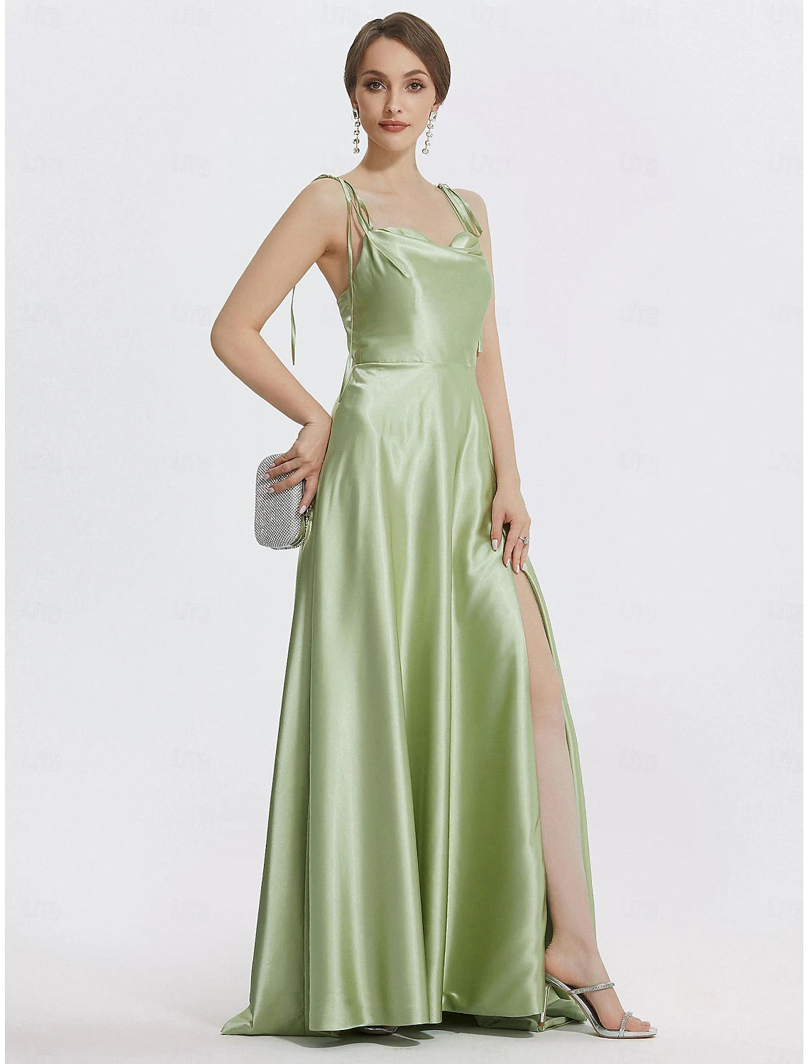 Sleeveless mint green satin evening dress featuring spaghetti straps and ruched detailing