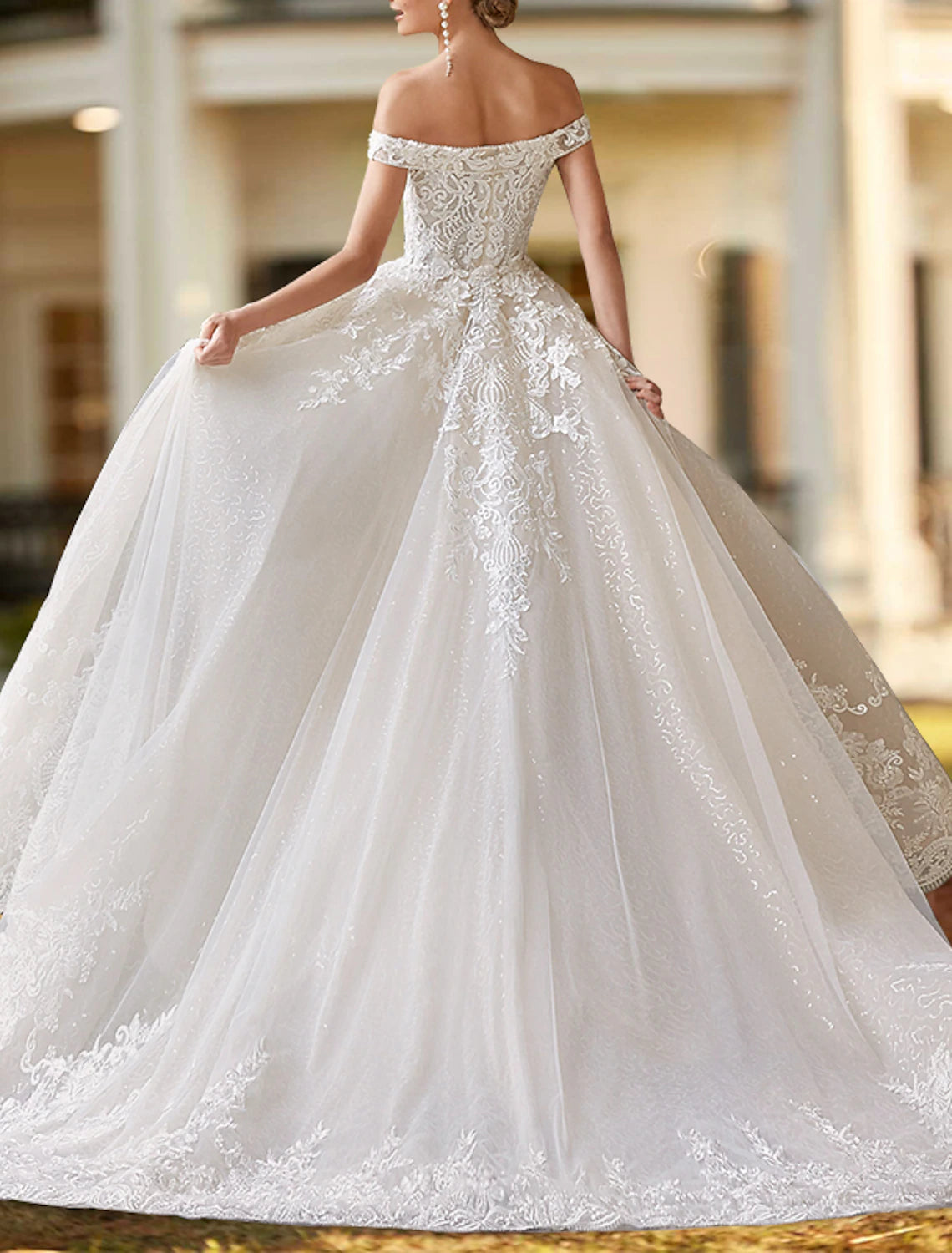 Ivory two-piece satin bridal gown featuring off-the-shoulder cap sleeves and beading appliques