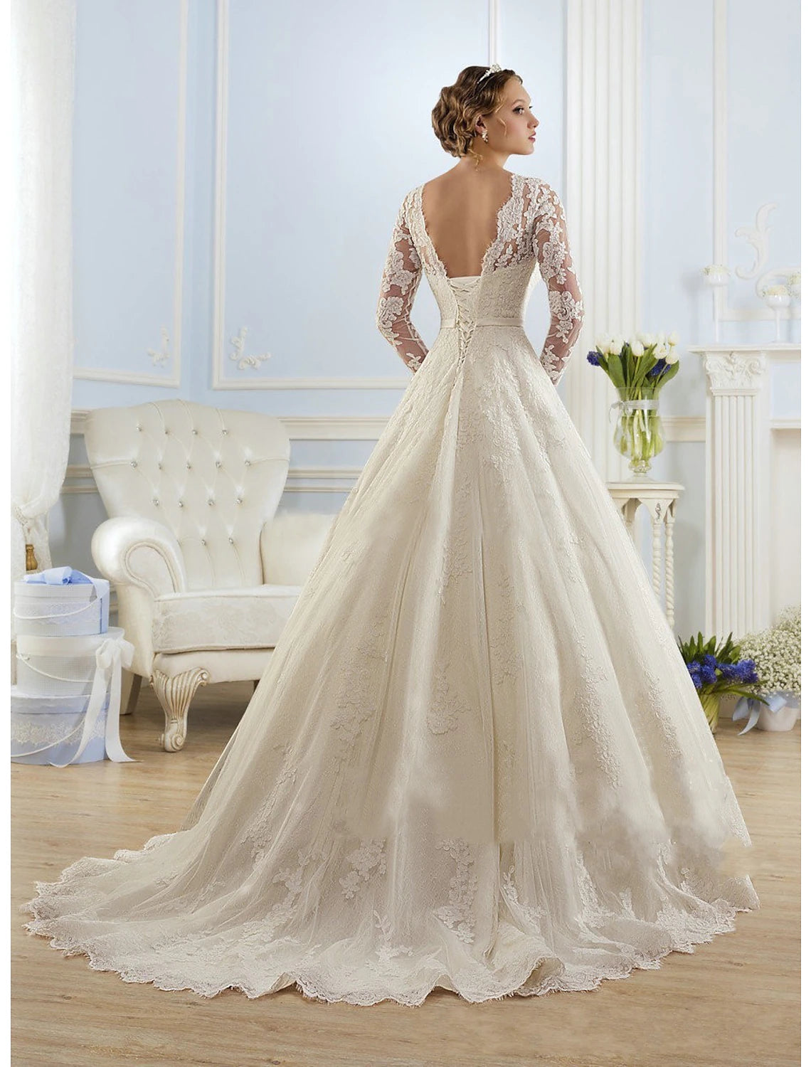 Ivory long sleeve ball gown bridal dress with lace appliques and court train