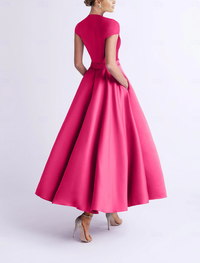 A-line tea-length satin cocktail dress with sleeveless V-neck bodice and bow