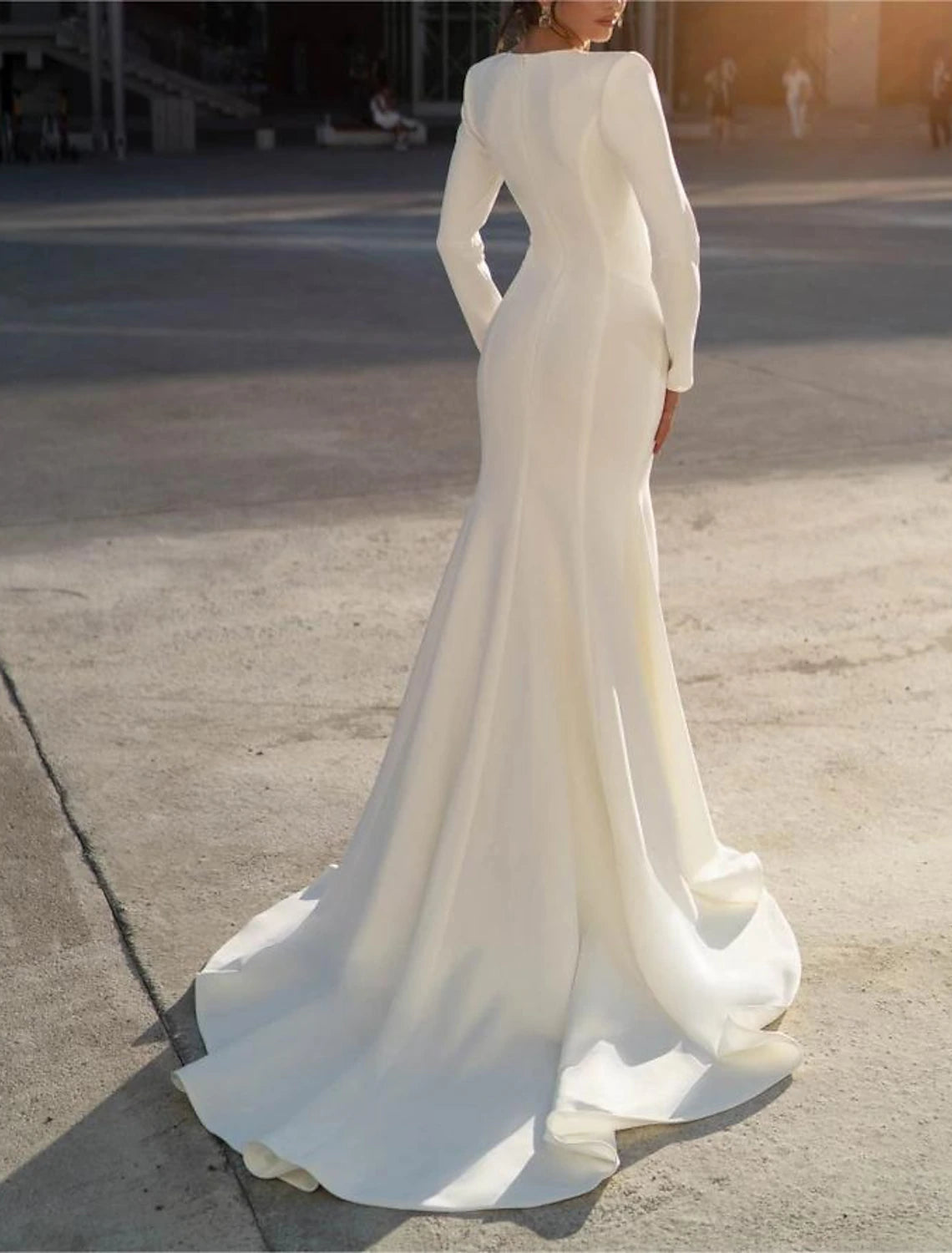 Long sleeve V-neck chiffon mermaid bridal gown detailed with beading
