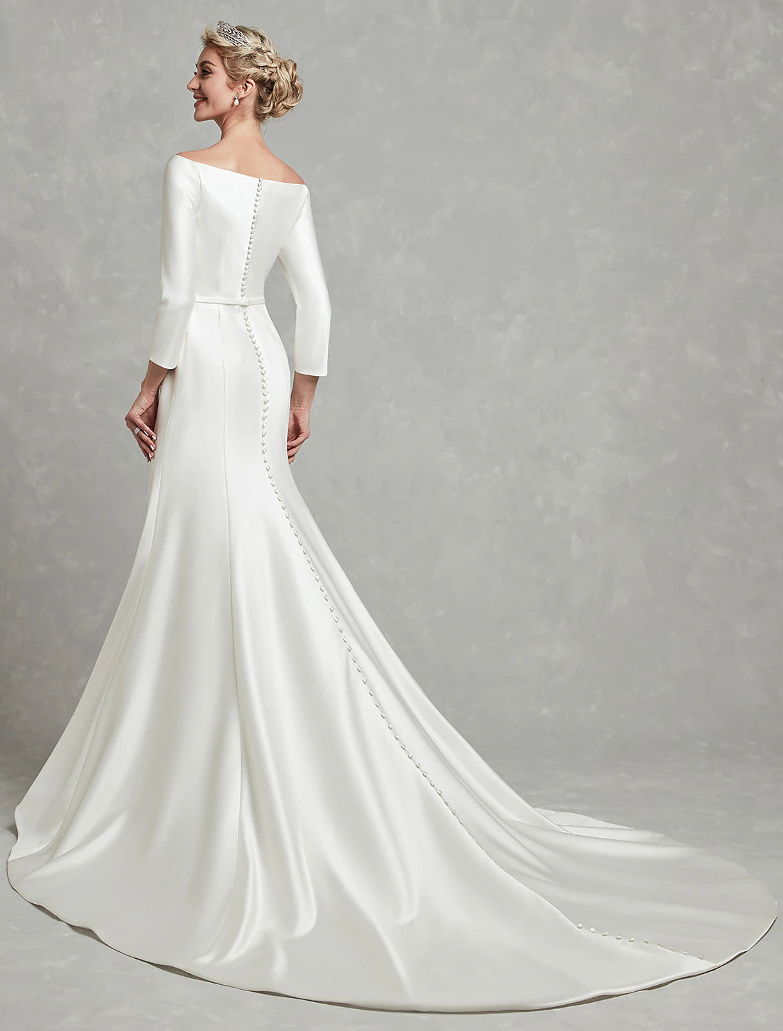 Pleated ivory satin mermaid bridal gown with off-the-shoulder neckline and chapel train
