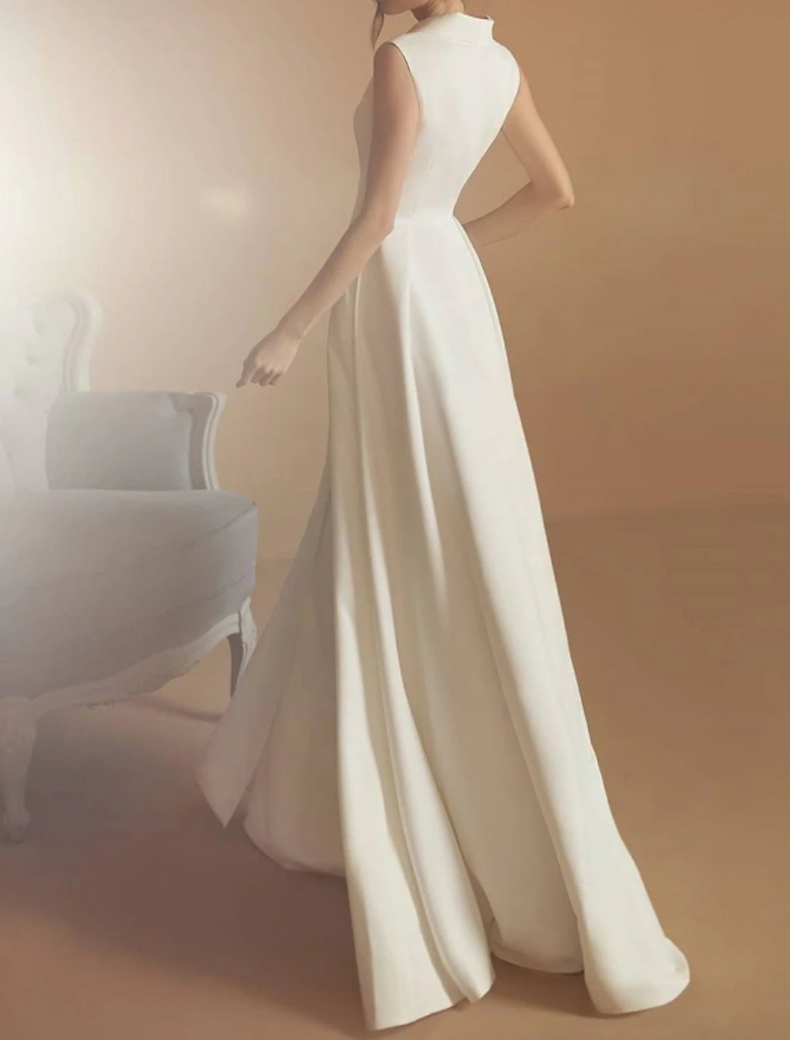 Ivory floor-length satin A-line bridal gown with sleeveless V-neck and split front